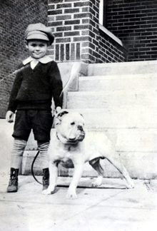 Peter at the age of 6, with his first bulldog, Speed.