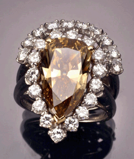 A 4.60-carat fancy deep brown-yellow pear-shaped diamond cocktail ring ($12/15,000) was consigned from a Maryland collection and found a new home at $25,850.