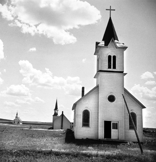 A superb photographer of the Dust Bowl era, Dorothea Lange documented a desolate scene of a community abandoned by its homesteaders in the face of drought and sandstorms, leaving three stark churches, in "Freedom of Religion: Three Denominations (Catholic, Lutheran, Baptist Churches) on the Great Plains, Near Winner, South Dakota,” 1938. The Museum of Fine Arts, Houston; The Manfred Heiting Collection. ©The Dorothea Lange Collection, Oakland Museum of California, City of Oakland, gift of Paul S. Taylor.