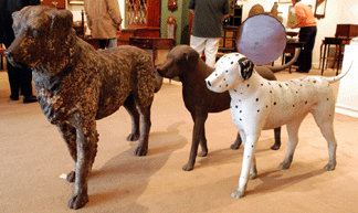 The cast iron dogs were popular items with the large cast iron figure of a golden retriever, left, selling at $57,500. The two Labrador-form dogs brought $4,312 for an unpainted example, center, while a similar dog, painted as a Dalmatian, was knocked down at $6,325.
