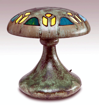 A handsome Fulper lamp in a rare mushroom-shape that was covered in a leopard-skin crystalline glaze set a record at $36,000. 