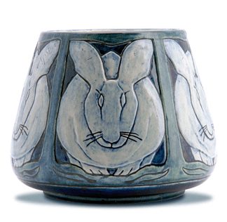 A 1902 Newcomb College vessel depicting stylized rabbits by Marie de Hoa LeBlanc sold for $84,000.  