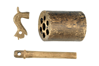 Models of an arbor pin, barrel group and hammer carved out of wood by Samuel Colt while he was aboard the brig Corvo in 1831. Colt gave these pieces to Hartford gunmaker Anson Chase in 1831 to serve as guides in the construction of a prototype pepperbox with a revolving group of barrels. Following Colt's suit against the Massachusetts Arms Company in 1851, Chase apparently returned the pieces to Colt. Wadsworth Atheneum Museum of Art.