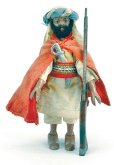 The rarest and surely one of the most desirable figures from Schoenhut's set known as Teddy's Adventures in Africa is the Arab chieftain. A jointed figure of painted wood, the chieftain is equipped with his original Arab-style rifle. Estimated at $4/5,000, the 8-inch figure was chased to $12,100.