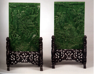 A pair of brilliant translucent green jade table screens  was carved with sages amid mountain landscapes that dated to the Ch'ien Lung period and bore Li Shu inscriptions; the pair sold for $116,000 to a dealer in the room.