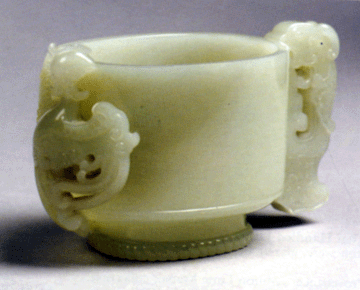 The successful bidder on the phone who paid $105,000 for the 5-inch Eighteenth Century Chinese cup in pale greenish white jade carved with a chih lung and a phoenix was impatient with the usual bid increments and jumped the bids in his haste to win the cup.