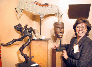Merrill Domas with a selection of Native American materials from the booth of Domas and Gray, Old Chatham, N.Y.