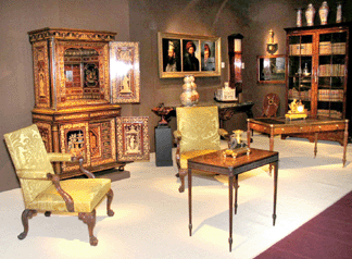 The spectacular Regency penwork cupboard, center, of circa 1820 was the centerpiece of Kentshire Galleries' stand.