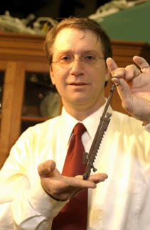 Gary Klinger, York, Penn., with Eighteenth Century sawtooth wrought iron trammel with five, finely forged hearts.