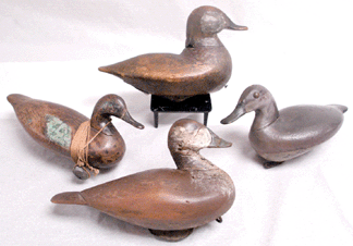Southern decoys, from left, included the Lee Dudley, Knotts Island, N.C., ruddy duck that sold at $34,500, the Captain Ben Dye ruddy duck $23,000, a John William ruddy duck $8,625, and the John Williams blue-wing teal that was bid to $49,450.
