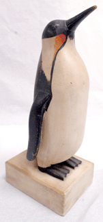 A selection of carvings that had descended in the family of Gloucester, Mass., carver Charles Hart included this penguin, measuring 12 inches tall, that shot past the $7/9,000 estimates, bringing $44,275.