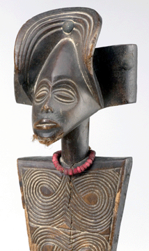 Headdress in the form of a female head, Ejagham, Asirikong association, Nigeria, late Nineteenth to early Twentieth Century, wood, hide, rattan, metal and pigment; 23 by 22 inches. Yale University Art Gallery. 