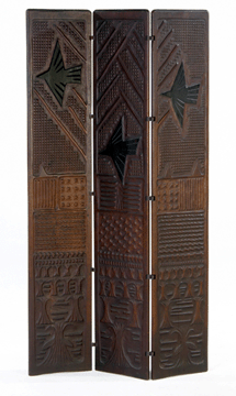 Wharton Esherick, 1927, walnut three-panel folding screen, extensively chiseled and chip-carved with alternating geometric patterns, depicting a landscape of three birds in ebonized wood flying over sheaves of wheat, sold for $312,000. 
