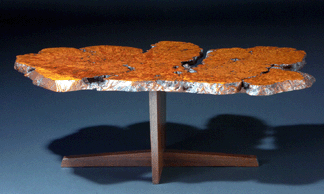 George Nakashima, coffee table with exotic burl free-edge top on Laurel Minguren I base, sold for $180,000. 