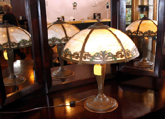 Albert Joseph & Company, Naugatuck, Conn., offered a vintage slag glass paneled lamp.