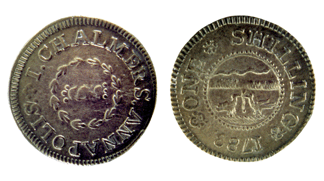 This 1788 Chalmers shilling, with dies created by Thomas Sparrow, both of Annapolis, was the first coin minted in the new republic. On the reverse is a wreath encircling two clasped hands, symbol of friendship. The obverse graphic is of two birds fighting over a worm while a snake lies in wait behind a hedge.