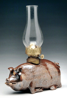 One of the many surprises centered on a seemingly unending phone bidding battle that ul-timately proved that pigs could fly. Bids mounted for this pottery figural mini lamp that closed well beyond its $400/600 estimate at $14,950.