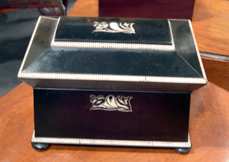 Essex Antiquarians had an ebony and ivory tea caddy for sale.