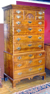 The New Hampshire tiger maple chest-on-chest was attributed to John Dunlap, but had been refinished and sold for $22,425. The chalk initials "JD” were still visible on a drawer.