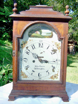 Table clock, Wilmington, Del., 1790–1805. Eight-day brass fusee movement with crown and verge escapement by Thomas Crow (working 1770–1824). Case maker unknown. "Ziba Ferris/Wilmington” painted on dial. "Made by Thomas Crow/Wilmington” engraved into back plate of movement. Mahogany, mahogany veneer, singed light wood inlays, tulip poplar, painted iron dial; 17¼ inches tall by 10 3/8 inches wide by 7½ inches deep. Collection of Mr and Mrs Edward F. LaFond Jr.