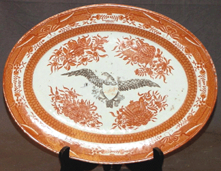 The orange Fitzhugh platter with eagle decoration did well at $8,050.
