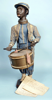 A rare and desirable papier mache figure of a black drummer boy with a drumstick-regulated clockwork brought $17,920. 