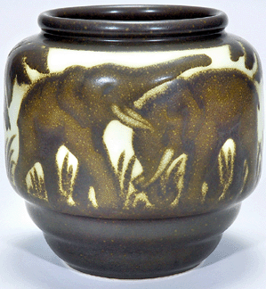 A 7¾-inch Boch Freres stoneware vase showing playful elephants fetched $17,250.
