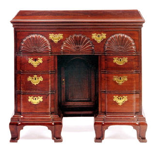 The Chippendale block-and-shell carved mahogany bureau table attributed to John Goddard or Edmund Townsend of Newport, R.I., sold for $520,000.
