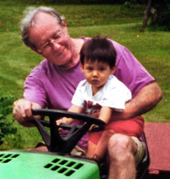 John Robinson, teaching a grandson the ropes.