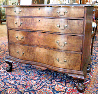 The tiger maple Chippendale reverse serpentine chest achieved a record price for a tiger maple example selling for $86,250.