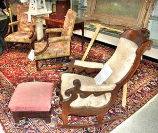Thomas Day rocker and footstool,sold for $9,500 to a phone bidder that turned out to be the North Carolina Museum of History in Raleigh. In the background is the pair of circa 1740 Gainsborough chairs with needlepoint and petit point upholstery, $11,500.