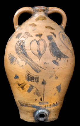 Of all Cushman stoneware, this two-handled jug ranks as a masterpiece of both craftsmanship and decoration. Almost certainly it was made as a presentation piece to mark a special occasion. The use of two hearts incised into the body may indicate a wedding, yet the Liberty Pole with flags suggests a political context. The basket of tulips on the reverse side is equally unusual. Stamped "PAUL : CUSHMAN'S,” it measures 23½ inches high. 