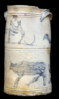 This highly decorated butter churn is a tour de force of folk design and a visual expression of regional folklore. Stoneware churn with elaborate incised decoration including fish suckling cow and cat churning butter, stamped "PAUL : CUSHMAN'S : STONEWARE: FACTORY : 1809 : HALF : A : MILE : WEST OF ALBANY : GOAL,” circa 1809. Albany Institute of History & Art, gift of John P. Remensnyder.