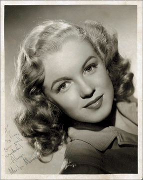 An early photo of Marilyn Monroe, signed and inscribed, took $27,738.