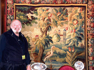 Exhibitor Walter Kornowski, Northgate Antiques & Interiors, Inc, Wheeling, West Va., is shown standing beside a circa 1810–1830 French tapestry that made a statement at 7 feet square in size.