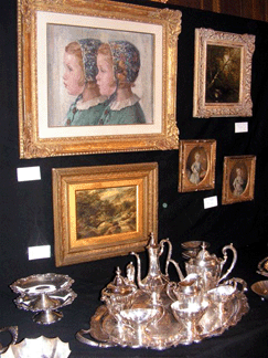 Front and center on the booth wall of Kimmerling Antiques, N.Y., was a Bertha Dorph oil painting of a double profile of two young girls at $6,500 and below, a seven-piece Reed & Barton coffee and tea service at $3,800.