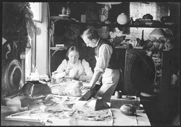 Clara Driscoll is pictured in 1901 in her workroom at Tiffany Studios with her chief assistant, Joseph Briggs. "A New Light On Tiffany: Clara Driscoll And The Tiffany Girls,” The New-York Historical Society.