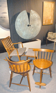 A selection of Harry Bertoia sculpture and Nakashima furniture in the booth of Lost City Art, New York City.