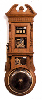 Visual indicator gong, 15 inches, with pull handle, with plate Reading "The Gamewell Fire Alarm and Telegraph Co., NY,” Victorian-style oak case, 53 inches high by 17½ inches wide, sold for $11,440.