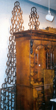 The Victorian mahogany linen press brought 2350 but the unusual pair of horseshoe obelisks behind it surpassed their estimate of 121800 to reach 6613