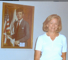 Auction patron Jeanne Manley New Vernon NJ stands near an oil on canvas portrait of Senator Kennedy that once hung in the Kennedys Georgetown home It sold for 6000