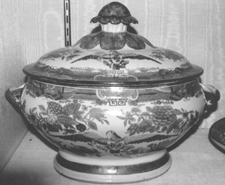 An orange Fitzhugh covered soup tureen and stand with a spreadwing eagle made for the American market sold to the phones for 54630