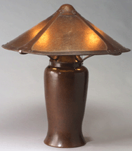The top lot was a pre1915 large Dirk van Erp table lamp with a copper and mica shade that came from the estate of the original owner It fetched 176250