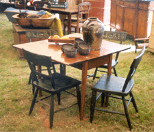 The Cottage Antiques priced the table at 400 and four painted chairs for 1200