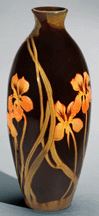 Rookwoods Standard glaze was its brand identity in the 1890s Vases of this type were often decorated with portraits or naturalistic floral decoration as seen on this 1899 example by John Hamilton Delaney Wareham