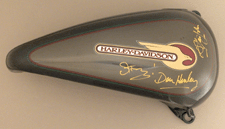 This Harley gas tank was signed by Sting Don Henley and Sir Elton John and sold for 1495
