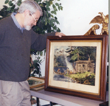 Tim Chaucer director of the Gulf Pond Museum in Milford examines The Hunter Shanty in the Adirondacks by Currier amp Ives which sold to an Ohio dealer for 2070