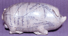 An Anna Pottery stoneware railroad pig flask with incised and blue filled map and sayings did well at 23100