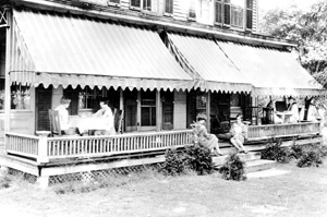 The Holcomb Tavern is the subject of this early postcard The tavern now a private residence on Main Street was built about 1860 The inn originally was three full stories with a mansard roof and a large cupola that collected rain for the water needs of the residents It had 17 rooms and seven fireplaces In 1938 the inn was sold and converted to a private residence The third floor was removed and replaced with an attic and gable roof Handcarved FederalColonial decorative details were added to the exterior At one time it was made into a threefamily home The 192728 Boys Basketball Team members have been identified by Barbara Parker of Hartford as follows from left front Deforest Glover Albert Kuhne William Leahy and Albert Nichols rear Andre Maye Bill Seman Coach Bill Baxter Fred Luf and Dick Primrose photo courtesy Carol Luf