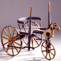 A painted wooden childs Velocipede Coach made by EW Bushnell Philadelphia midNineteenth Century 14100